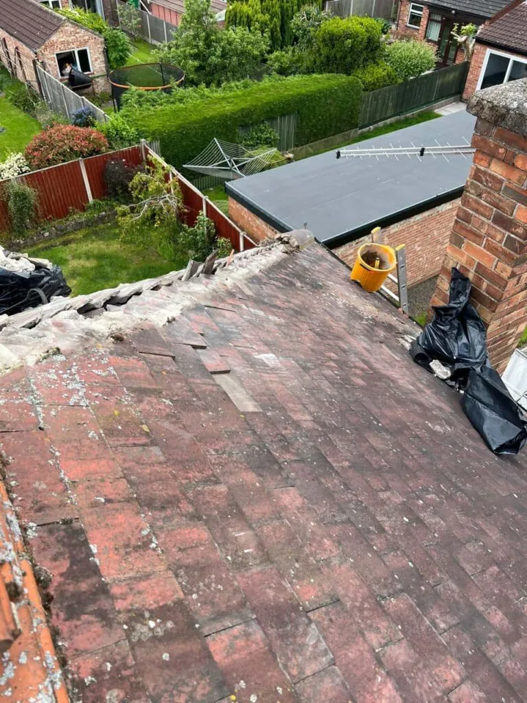 This is a photo of a roof where the hip tiles have been removed, and are just about to be replaced. Works carried out by MCM Roofing Repairs Romsey